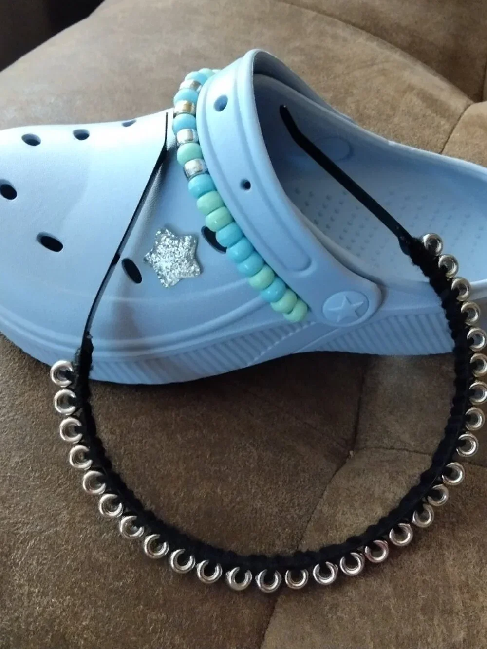 Embellished blue plastic shoes for kids with matching hair band.